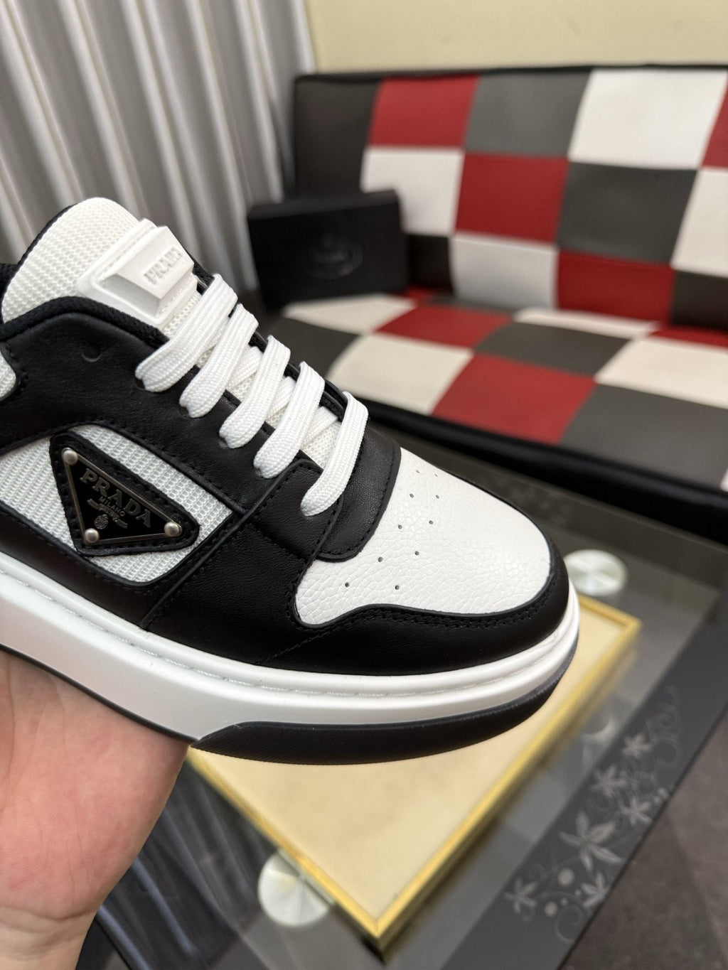 Prada Triangle Plaque Low-Top Sneakers — detail